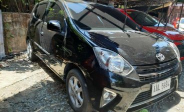 Selling Black 2014 Toyota Wigo in Marikina