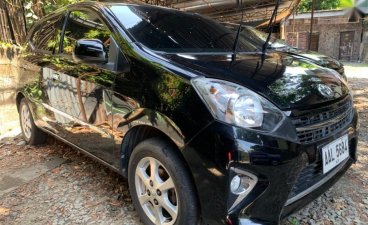 Selling Black Toyota Wigo 2014 Hatchback in Quezon City