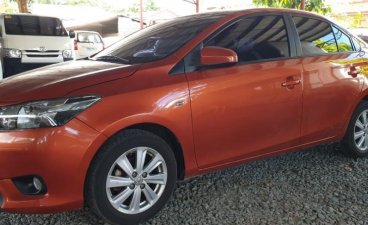 Orange Toyota Vios 2015 at 10000 km for sale in Quezon City