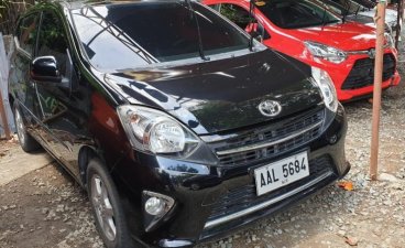 Black Toyota Wigo 2014 Automatic Gasoline for sale in Quezon City
