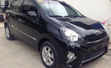Black Toyota Wigo 2014 Hatchback for sale in Quezon City