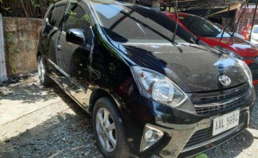 Sell Black 2014 Toyota Wigo in Quezon City