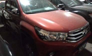 Selling Orange Toyota Hilux 2017 in Makati 