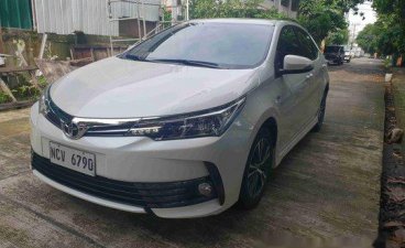 Selling White Toyota Corolla Altis 2018 Automatic Gasoline at 7000 km 
