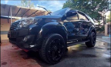 Selling Black Toyota Fortuner 2013 in Angono