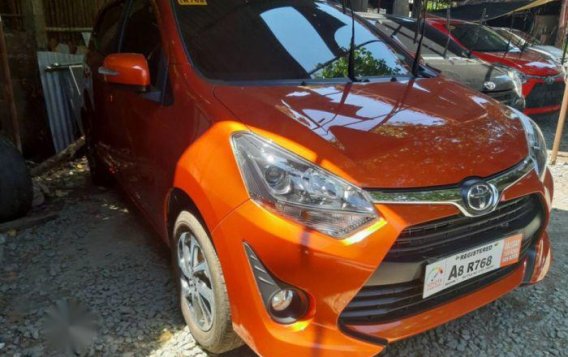 Selling Orange Toyota Wigo 2019 Manual Gasoline in Quezon City