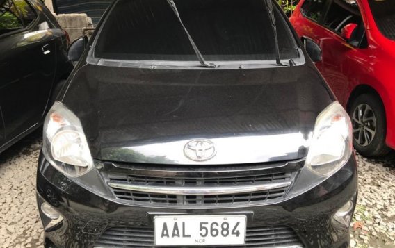 Selling Black Toyota Wigo 2014 in Quezon City