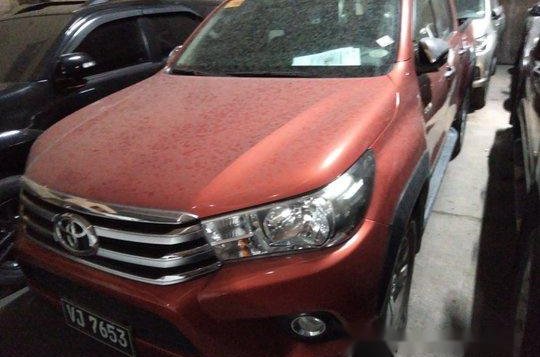 Selling Orange Toyota Hilux 2017 in Makati 