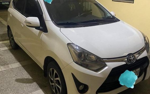 Pearl White Toyota Wigo for sale in Quezon 