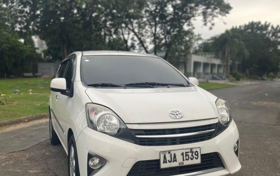 Pearl White Toyota Wigo 2014 for sale in Quezon City-7