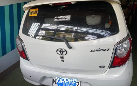 Selling White Toyota Wigo 2016 in Quezon City-1